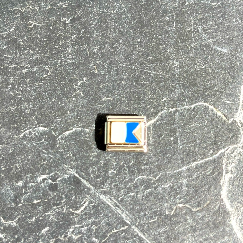 Zoppini Nautical NorthStar Flag initial A charm.
Stainless steel and gold charm